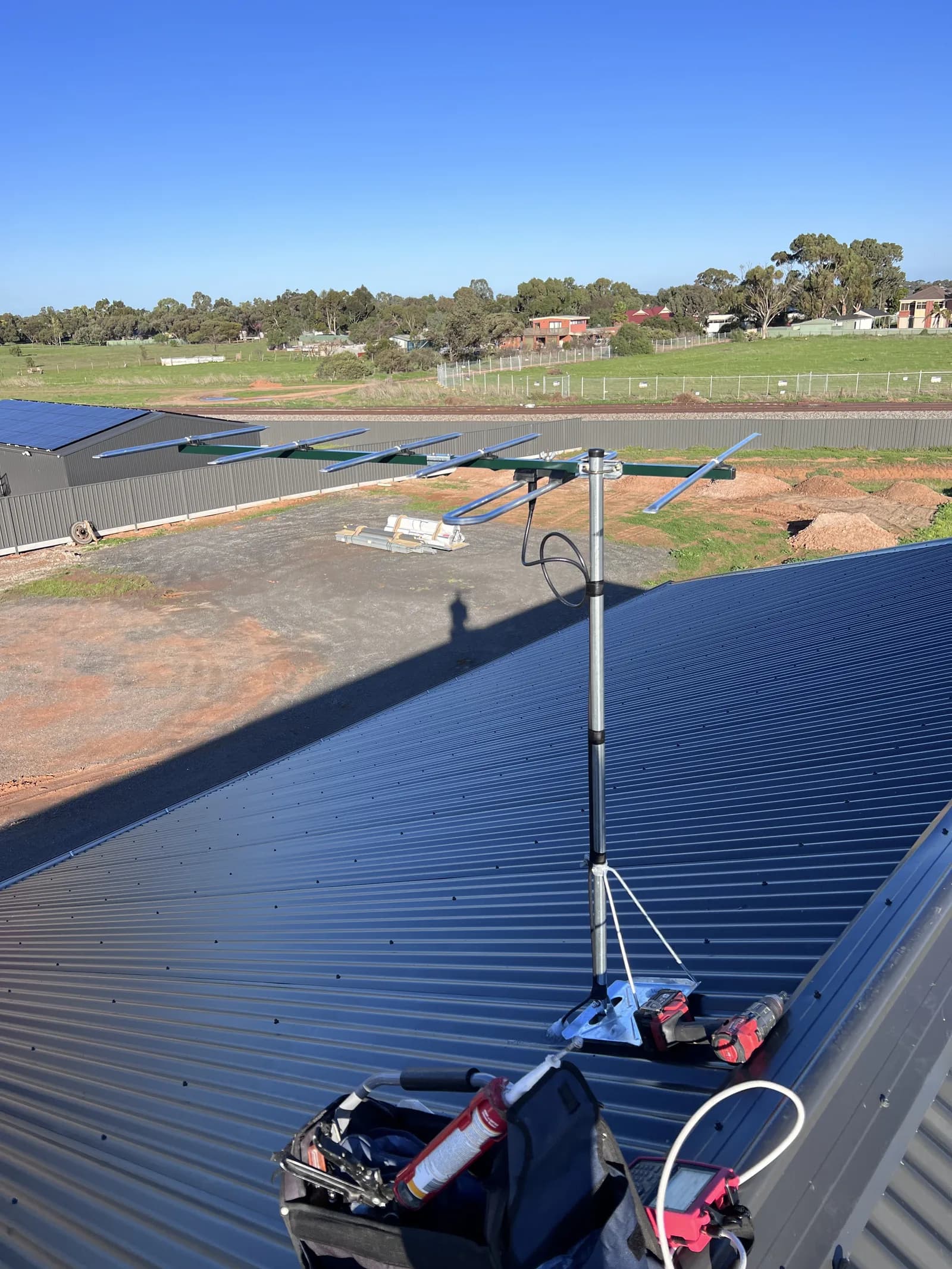 A new digital TV antenna freshly installed and mounted on an Adelaide rooftop