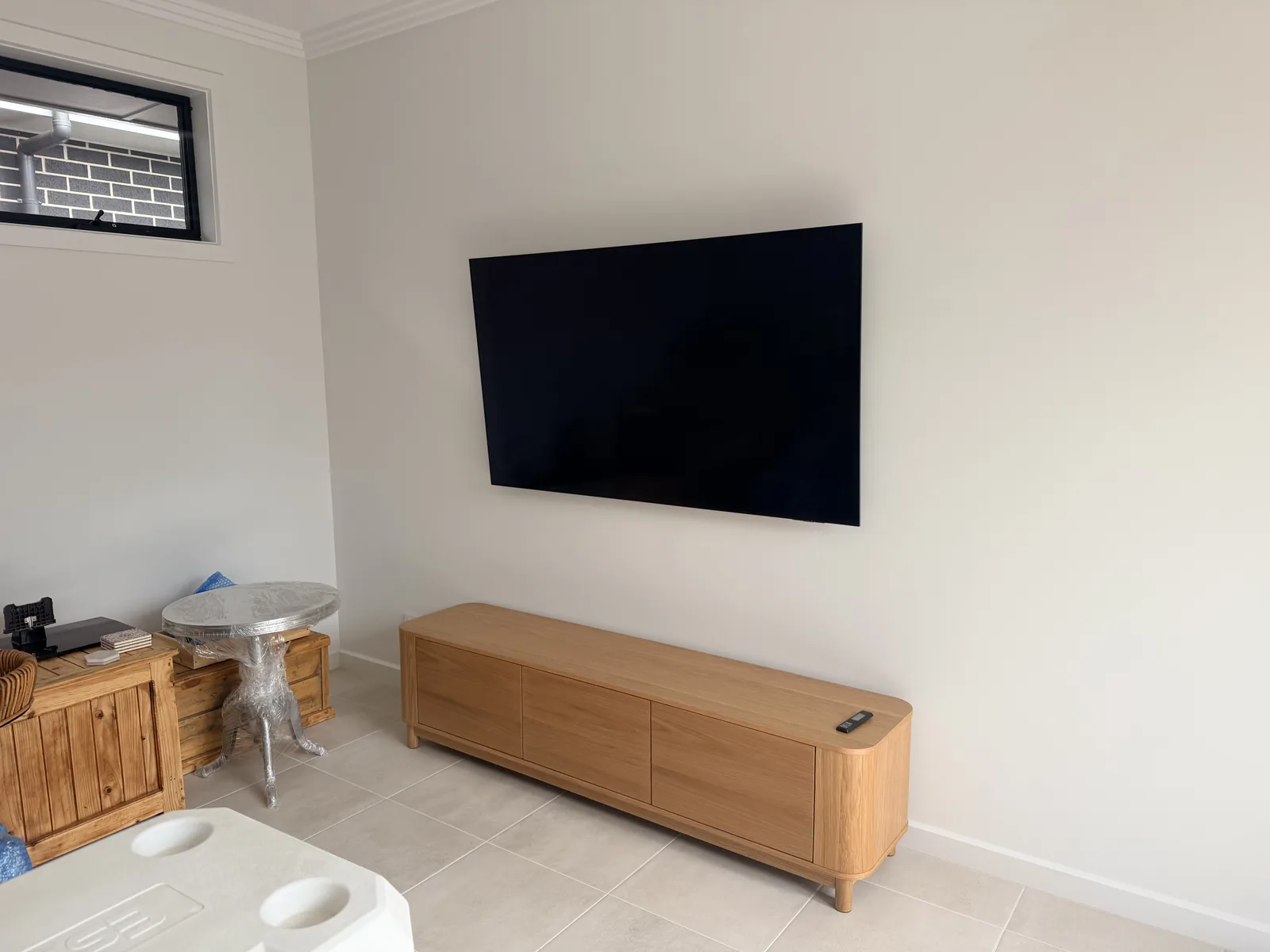 Tilting TV wall bracket mounted on a wall