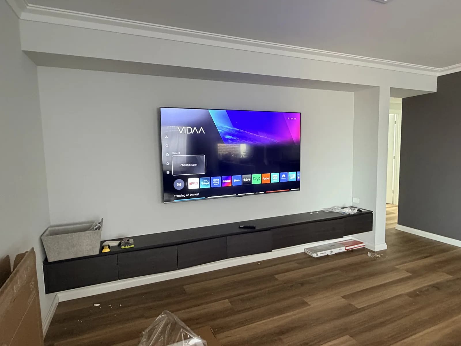 Large flat-screen TV wall mounted in an Adelaide living room with cables hidden in the wall